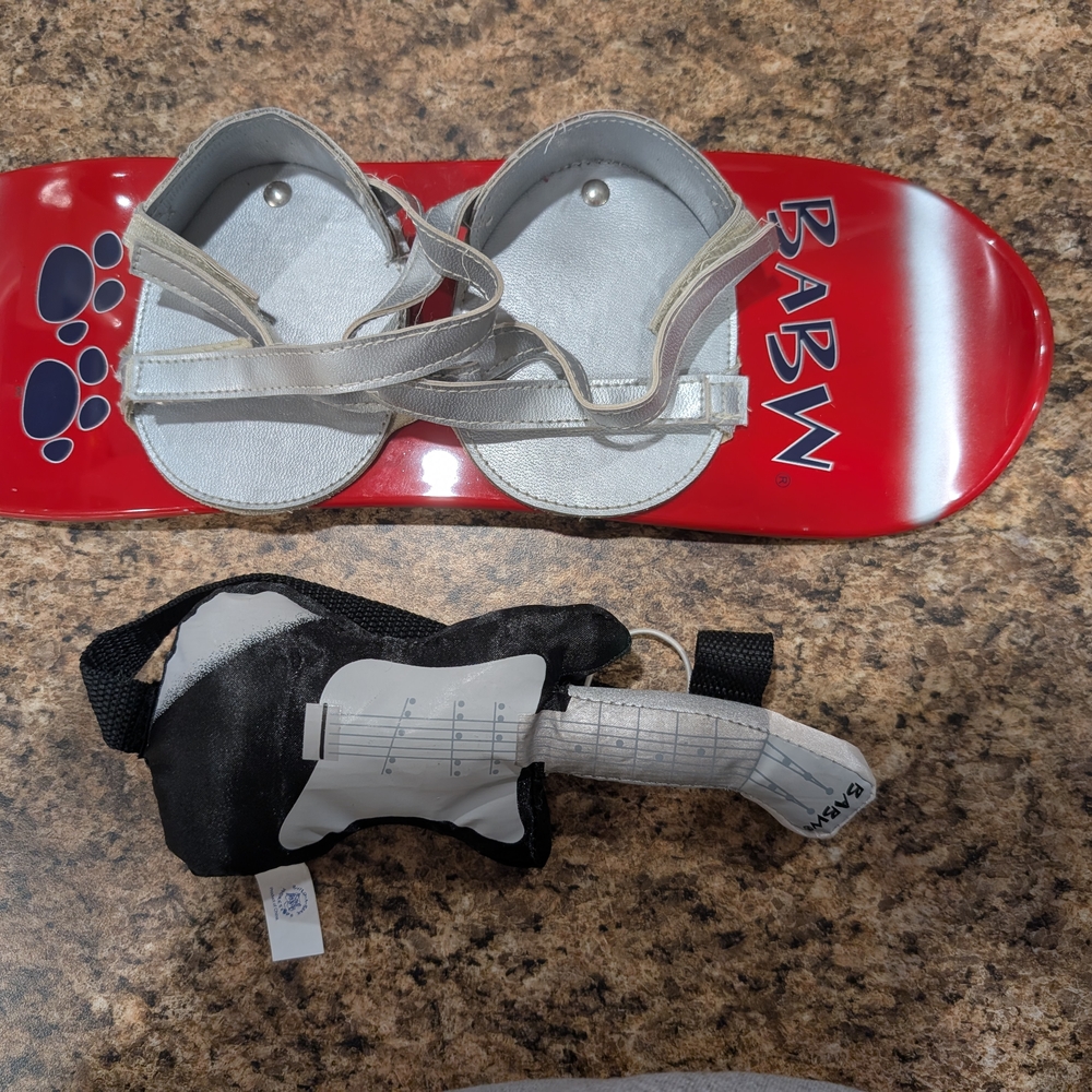 Red BABW Skateboard with Gray Sandals